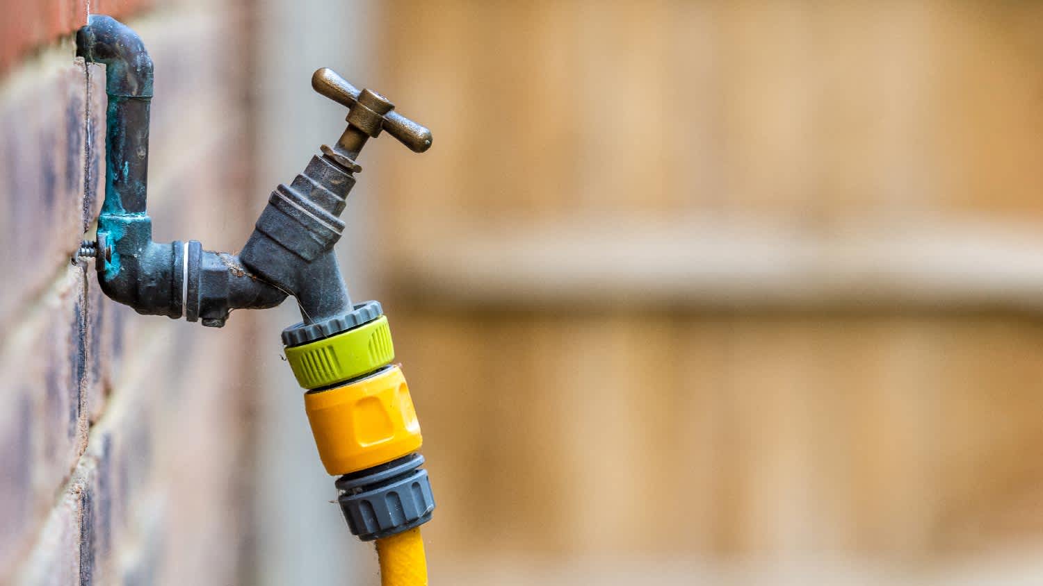 A regular hose bib with a hose attached