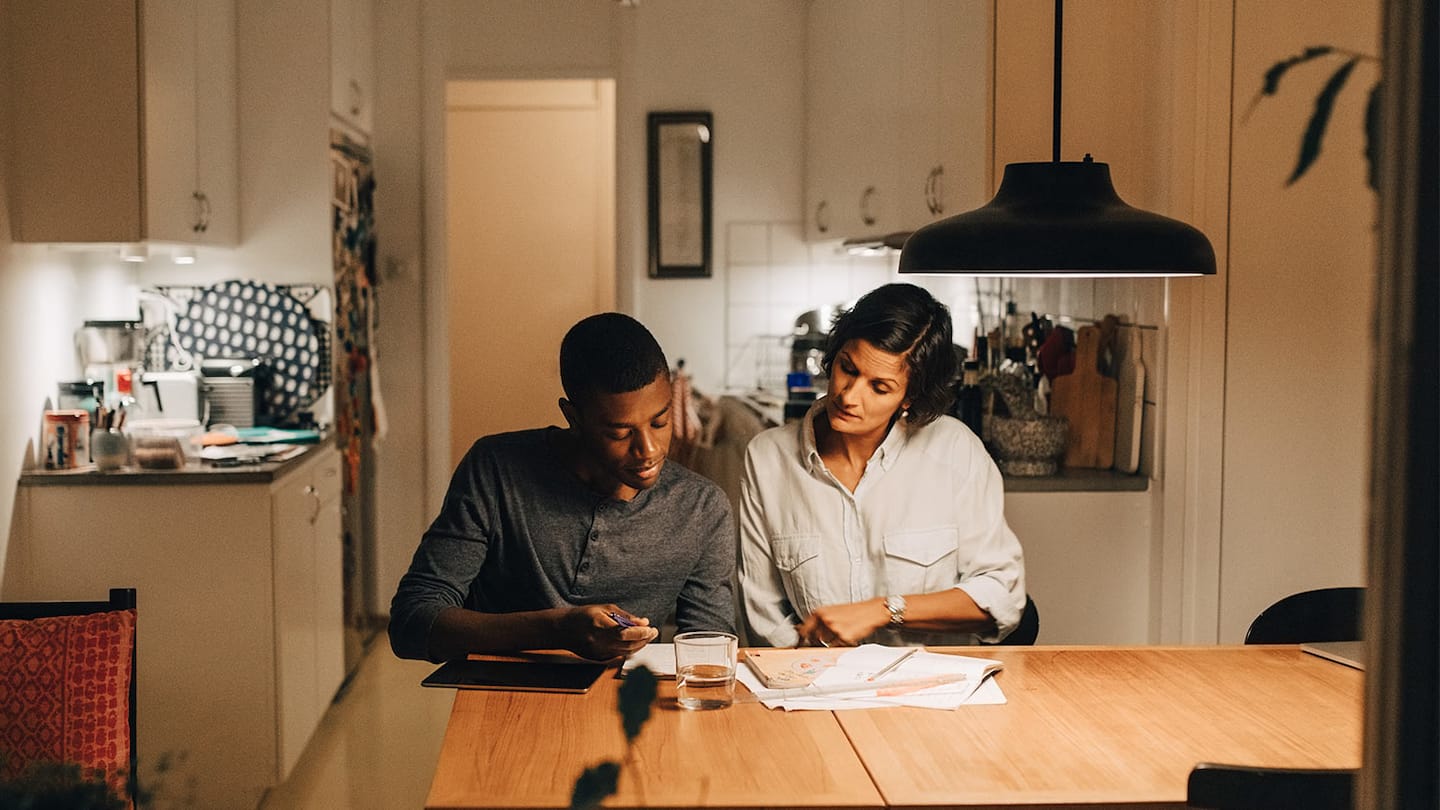 Couple reading kitchen table light