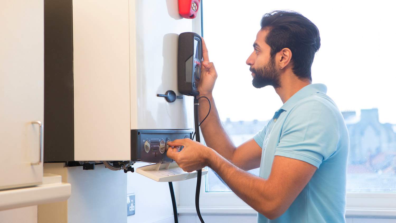 A professional testing a water heater