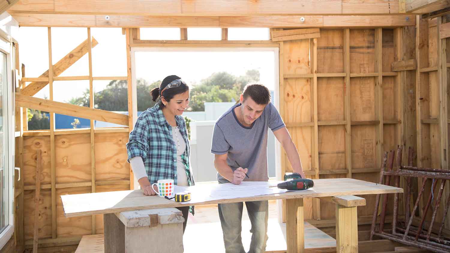 Couple working together on a home construction