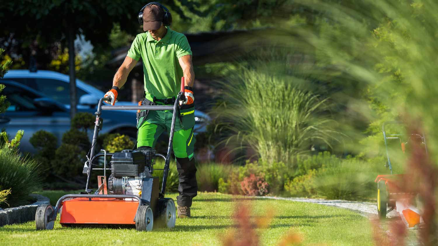 A professional using a scarifier