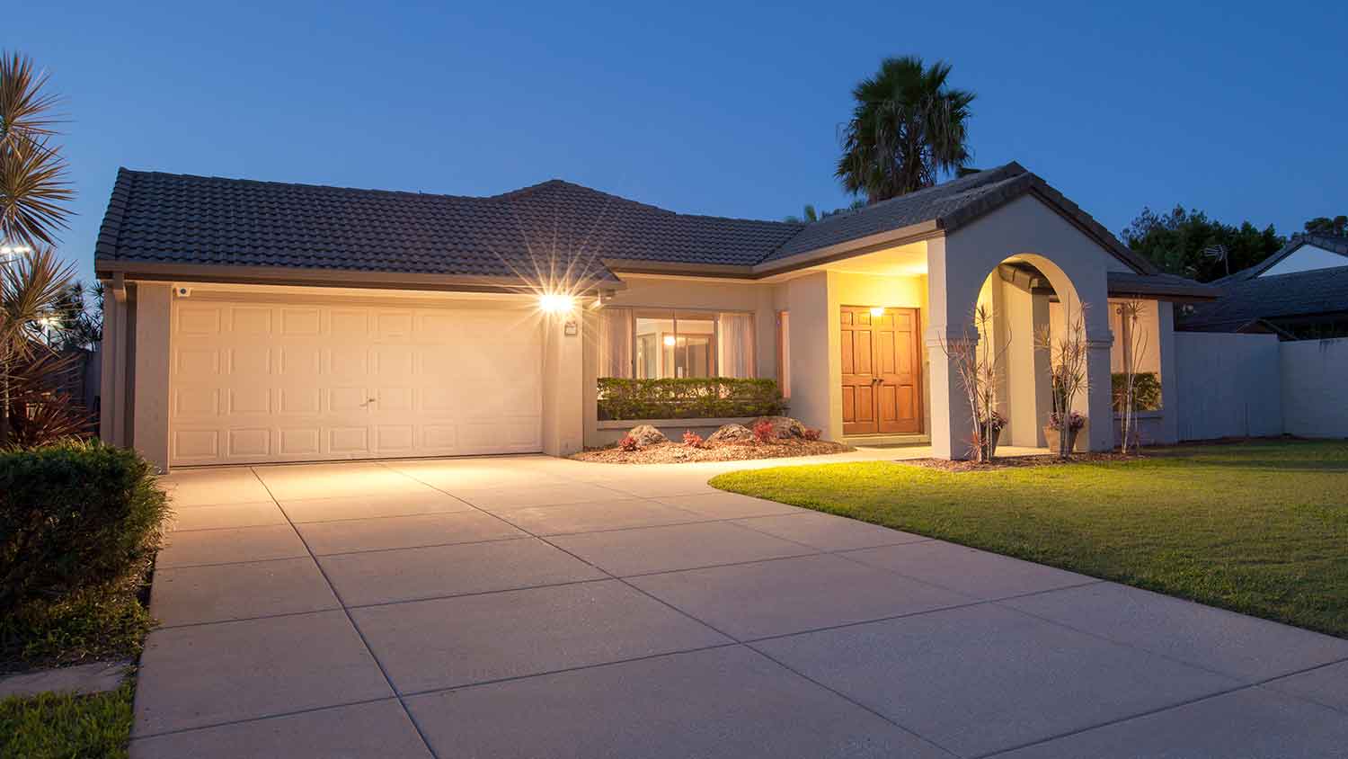Flood lights illuminating driveway