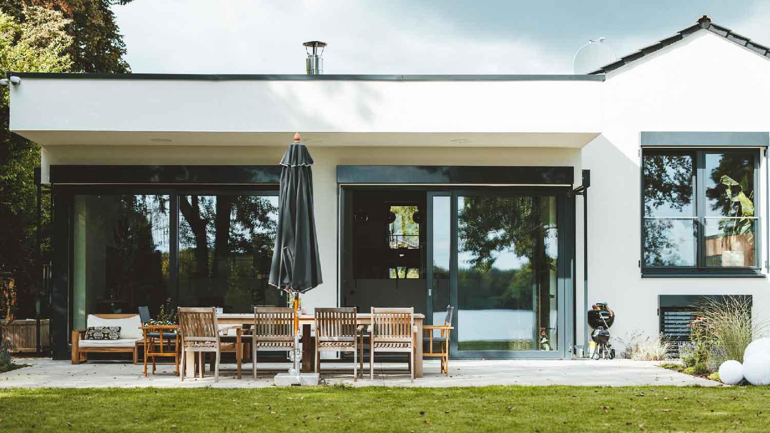 The exterior of a contemporary house with large windows
