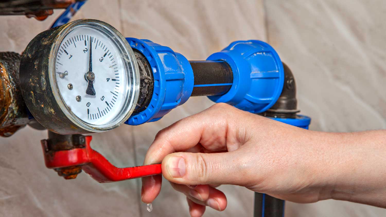 A woman testing the water pressure