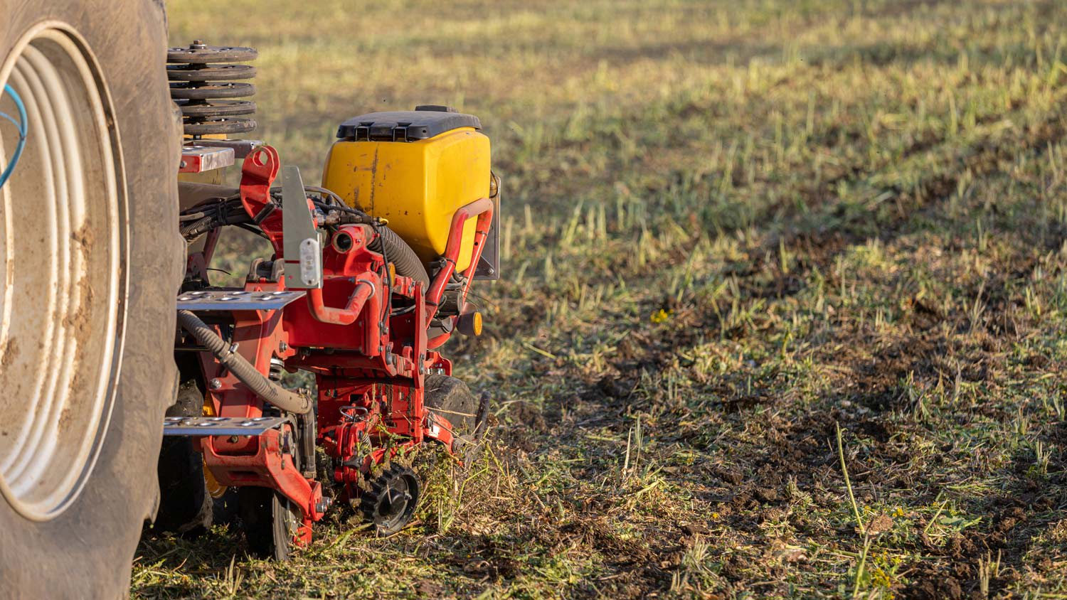 power seeding machine on large lawn