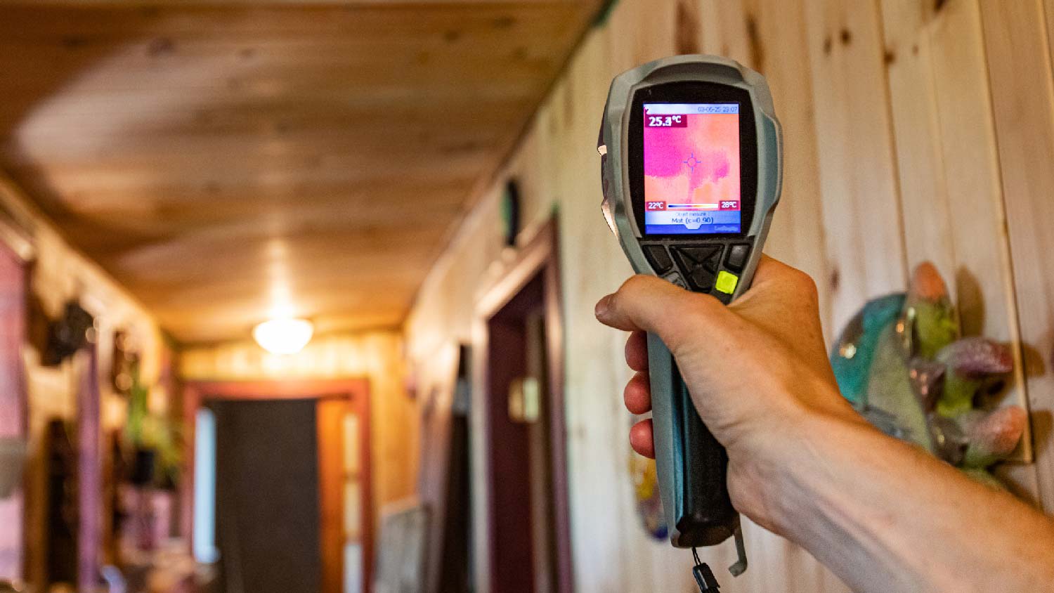 A person testing the air quality of a room