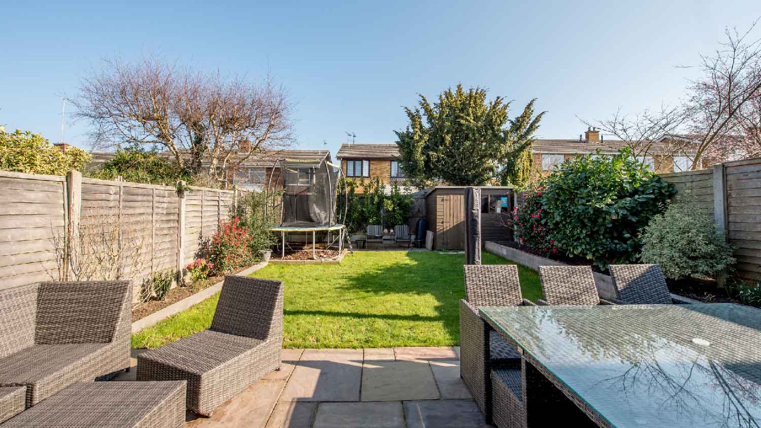 The backyard of a house with wooden fences