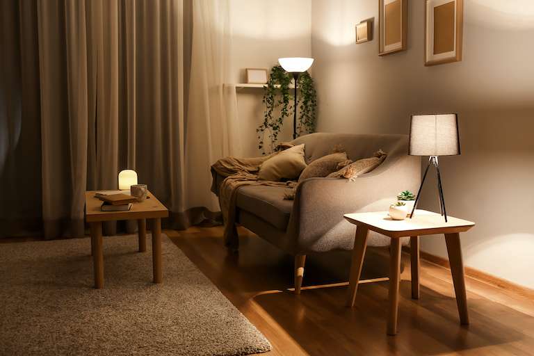 interior living room with two lamps and cozy candle light