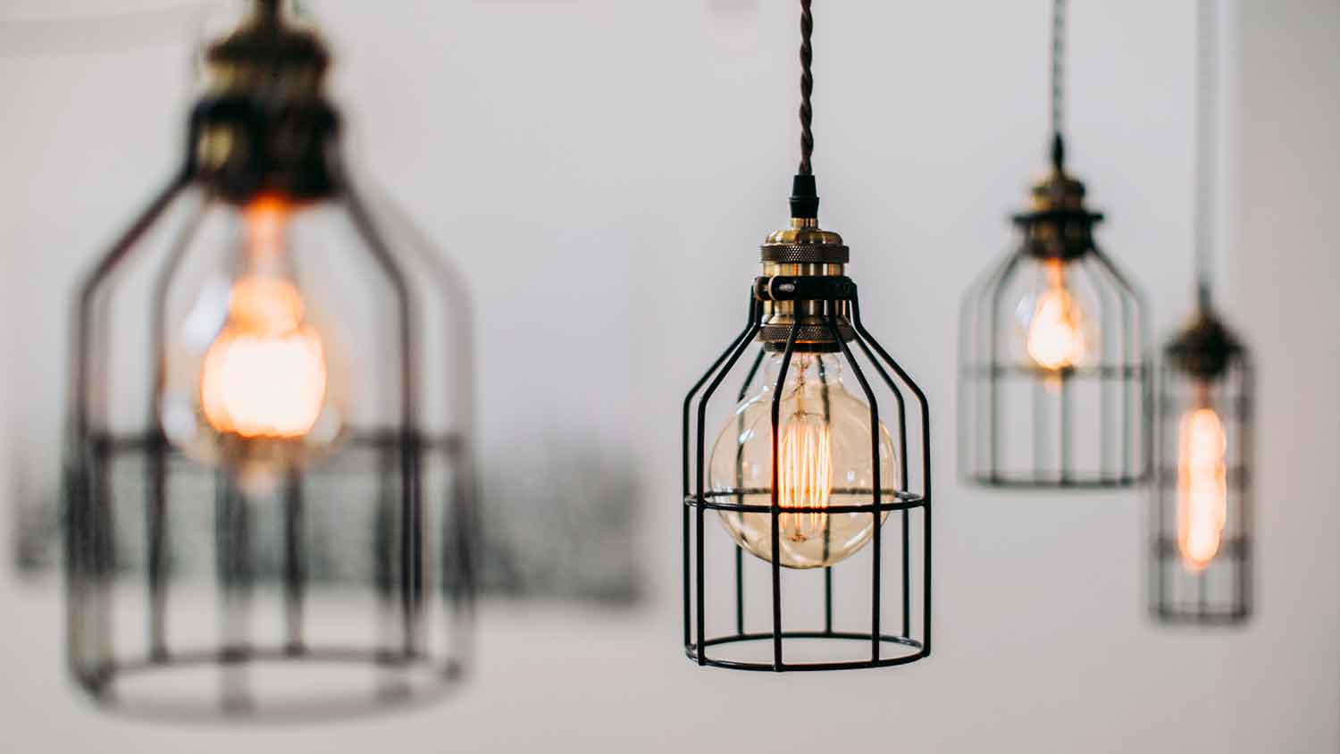 Modern pendant lights with warm lightbulbs