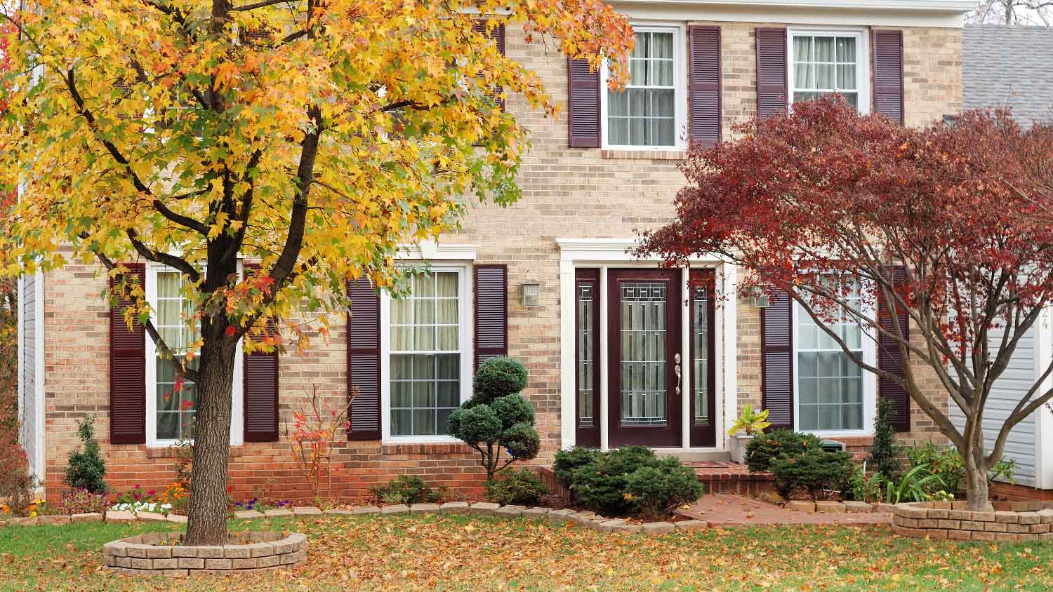 A beautiful house with trees in its front yard
