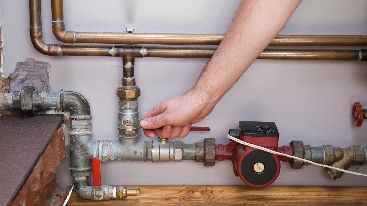 man turning off water supply