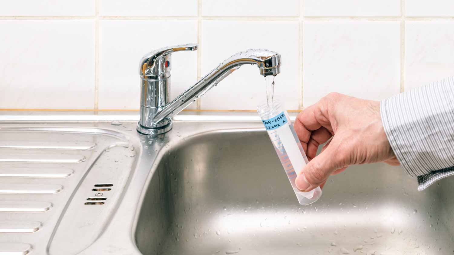 Man taking a sample of water