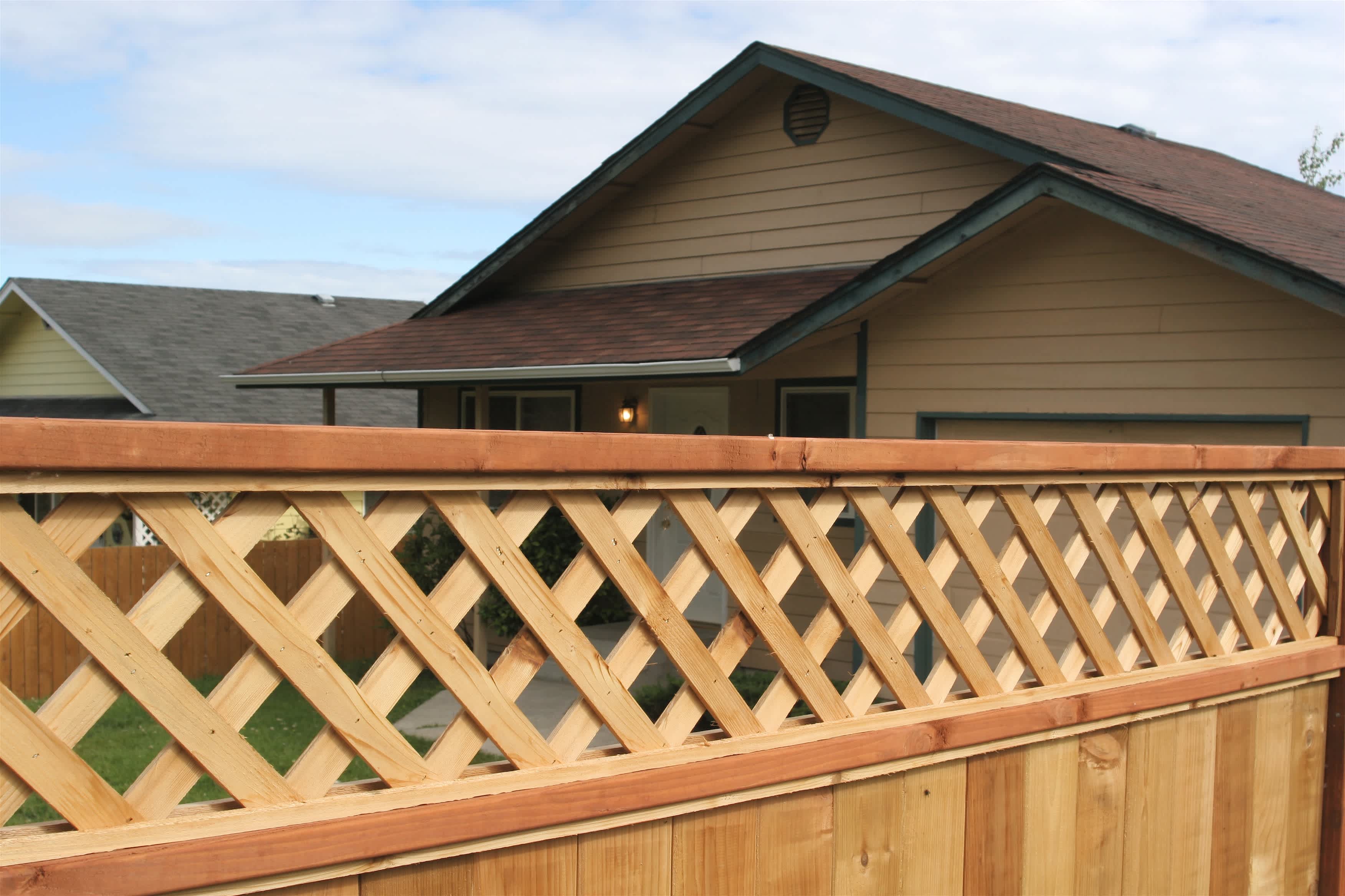 Wood privacy fence with lattice at the top