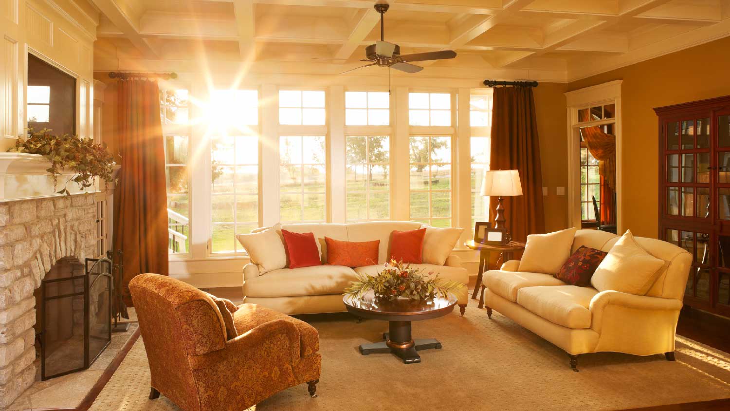 A bright living room with a ceiling fan
