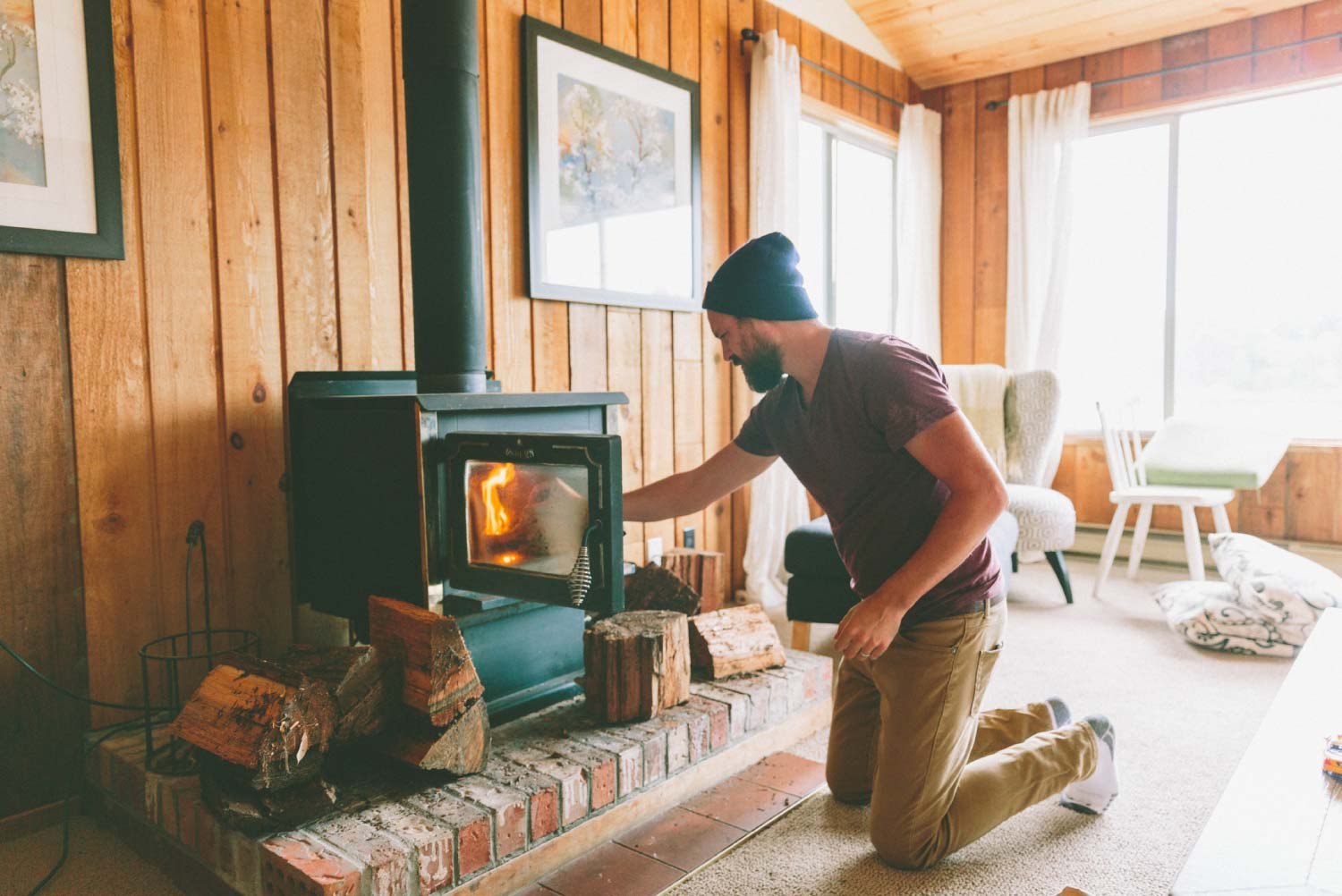 Man burning firewood at home