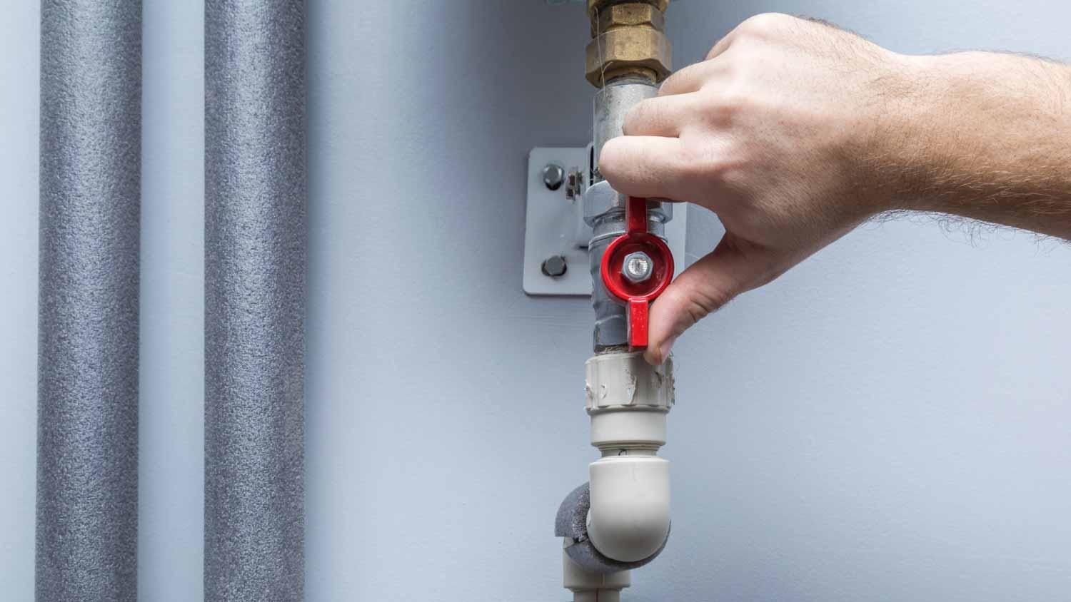 Man turning off water supply