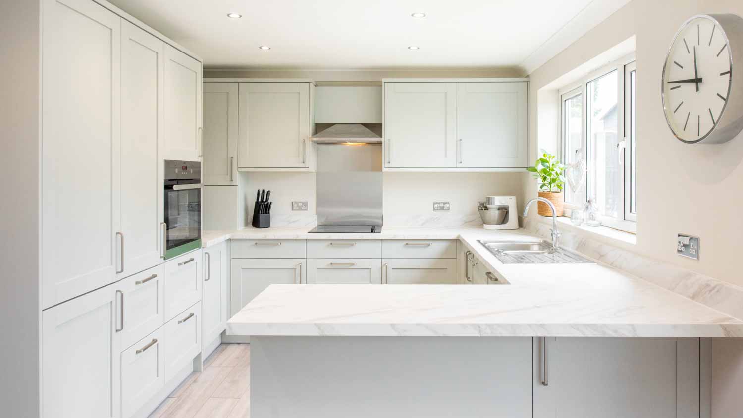Stylish kitchen with white cabinets