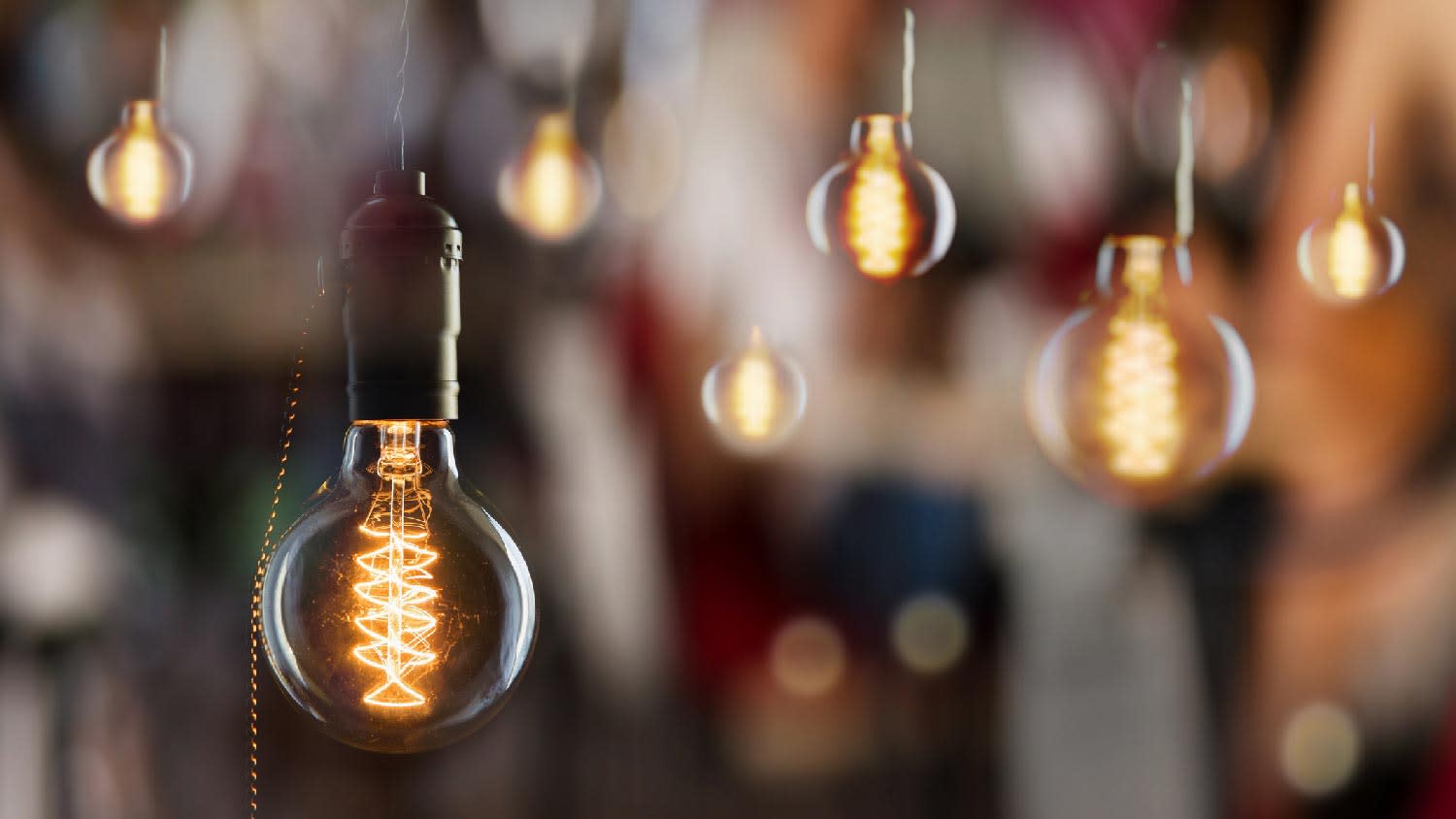 Incadescent light bulbs with window reflections