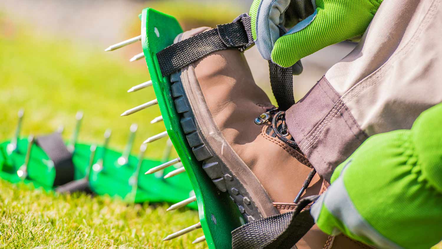 man strapping in aerator shoes