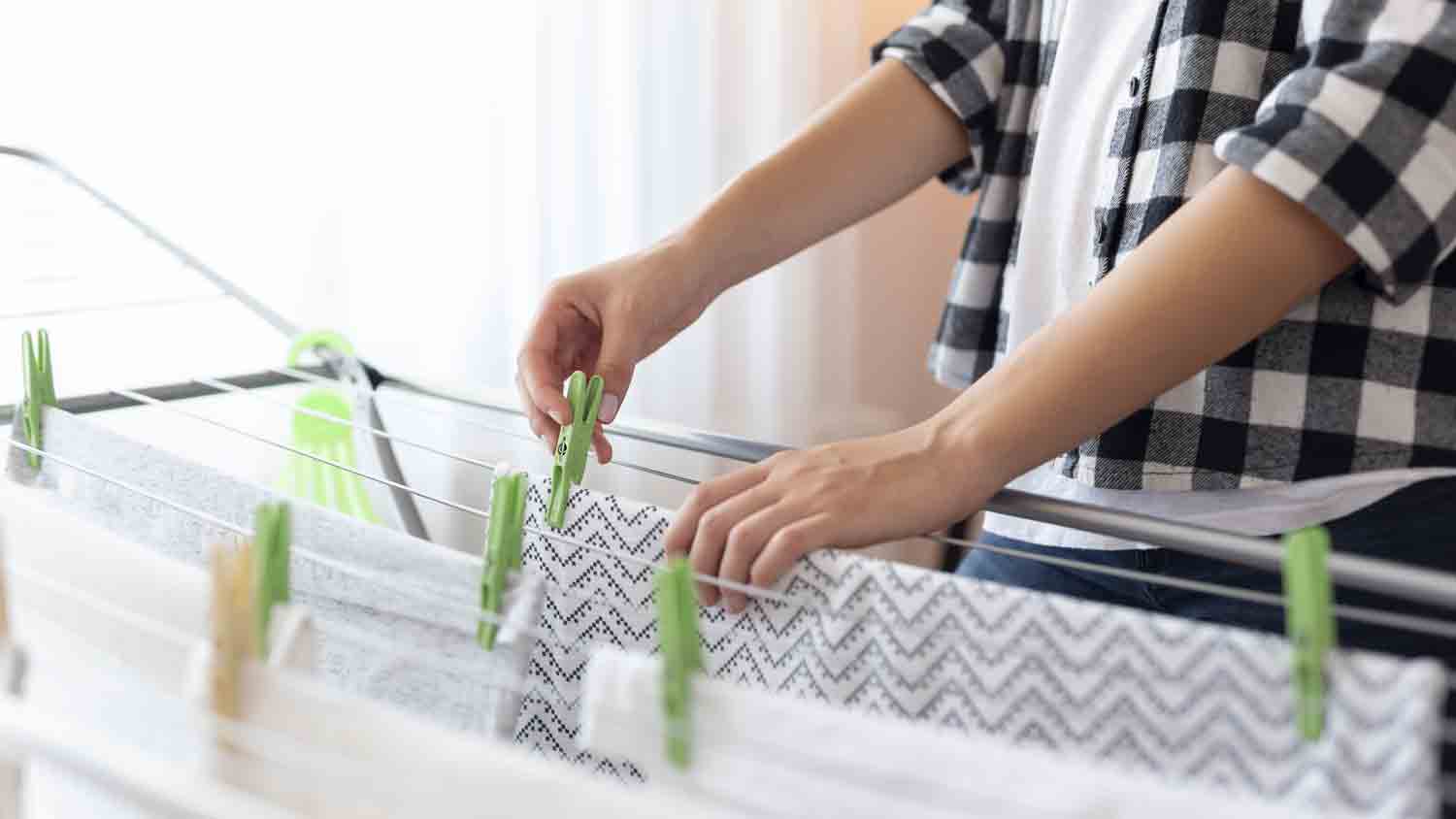 hanging wet clothes to dry at home