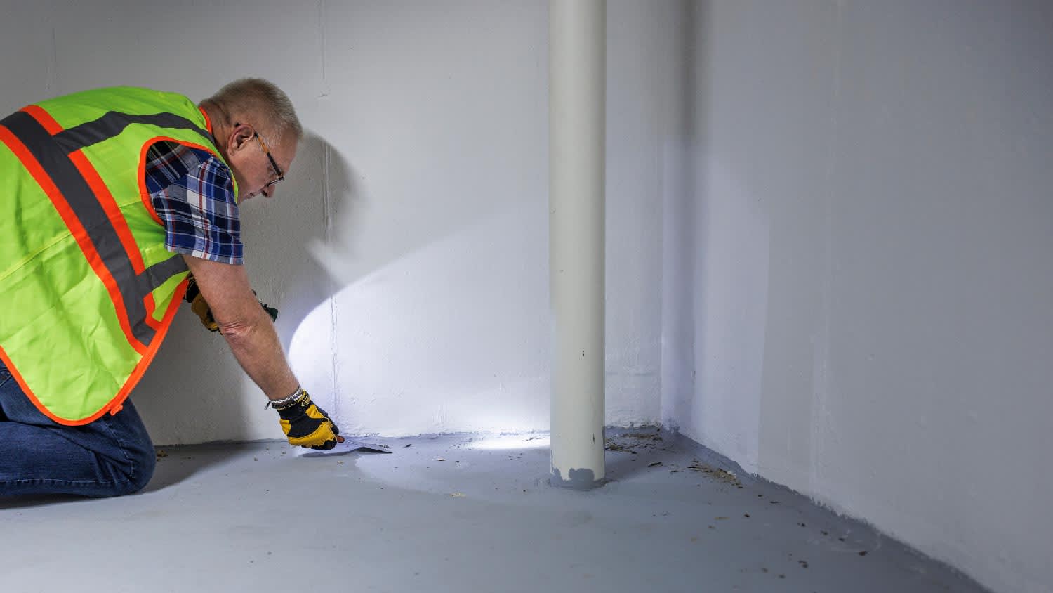 A professional inspecting for mold in the basement
