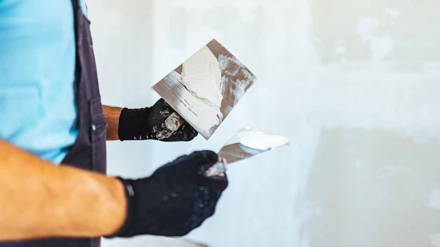 Man plastering a wall