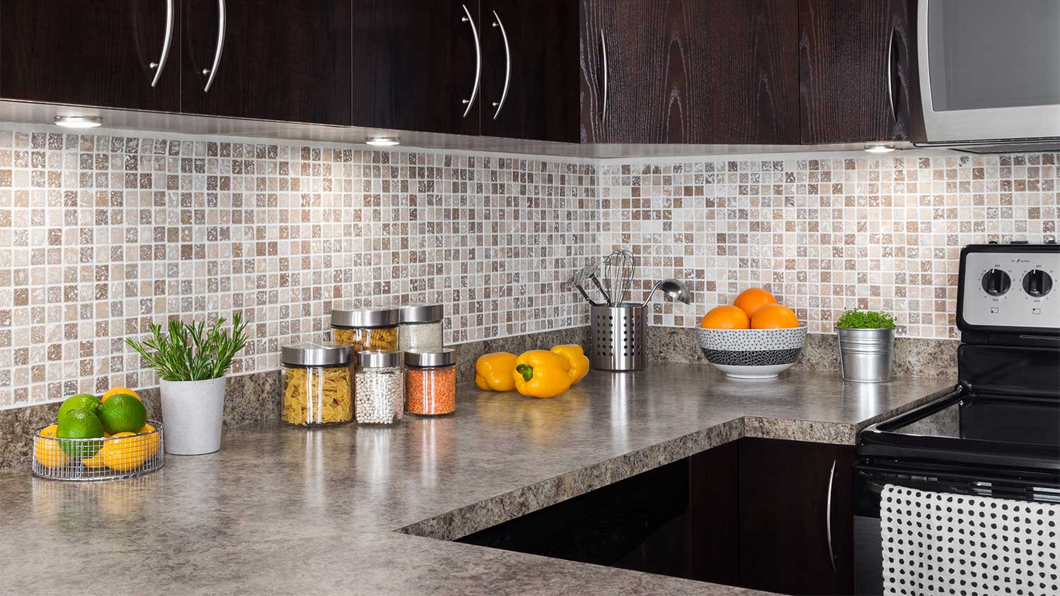 Kitchen with brown cabinets and Formica countertop