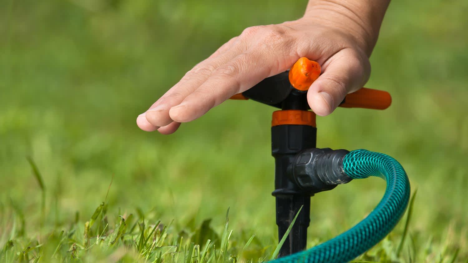 man installing sprinkler system