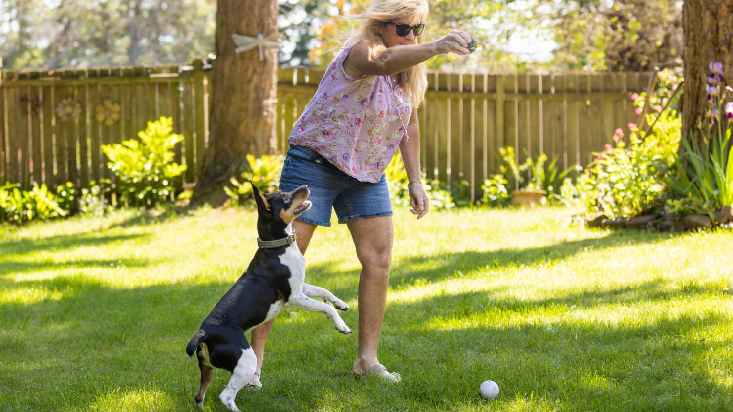 Woman playing with her dog