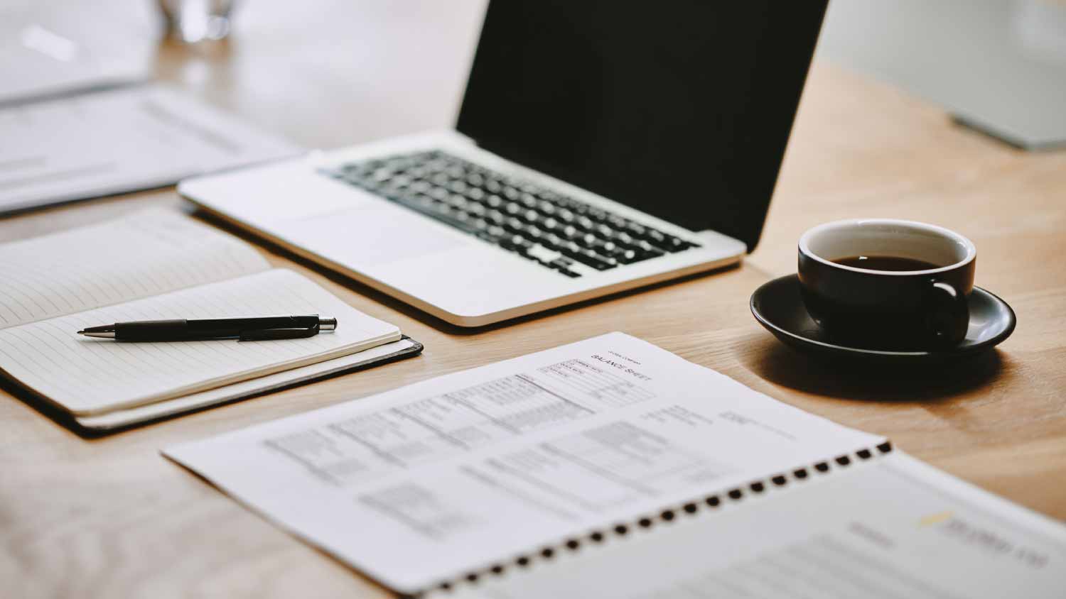Notebook and laptop in an office