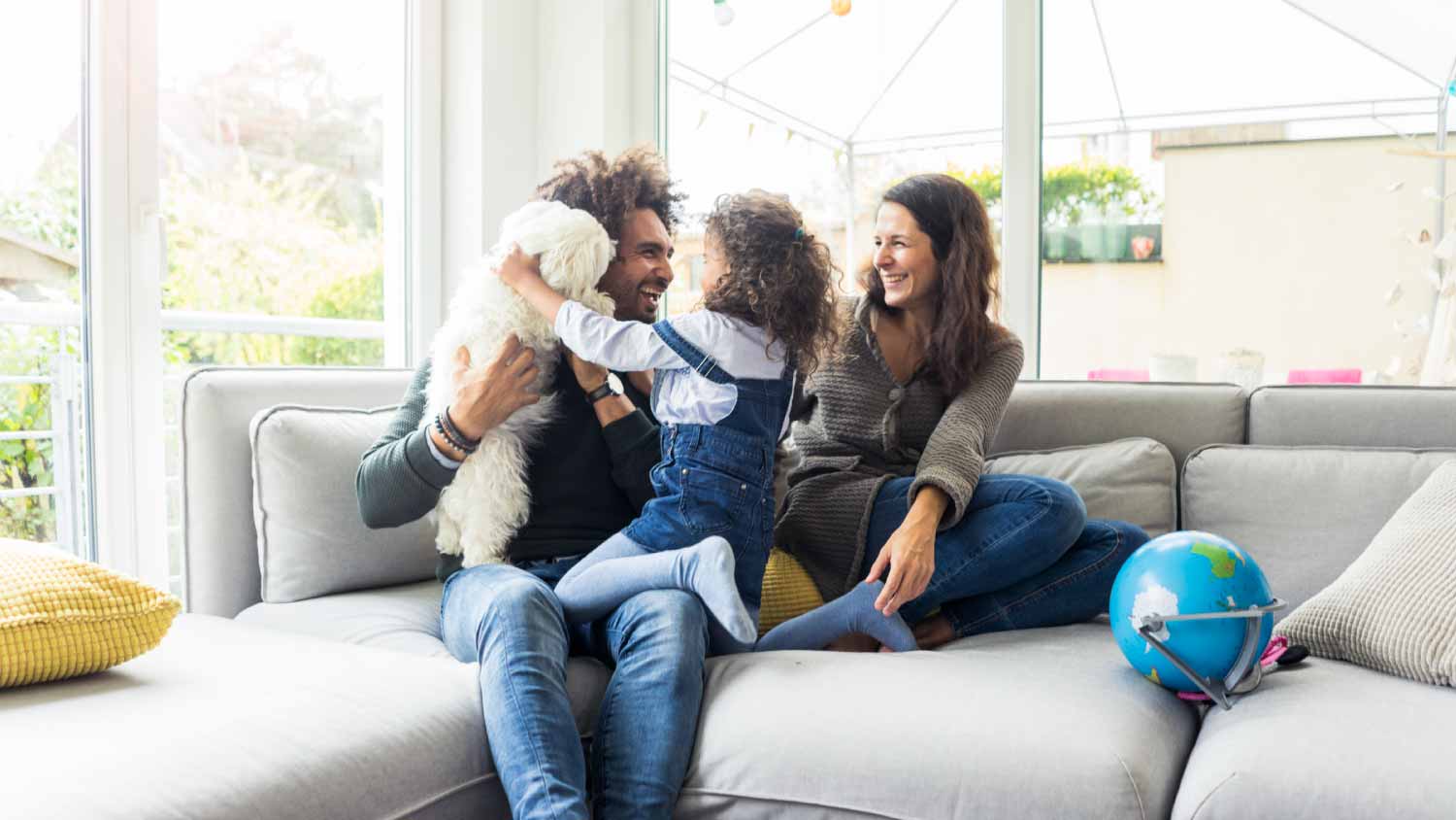 family with dog sitting together