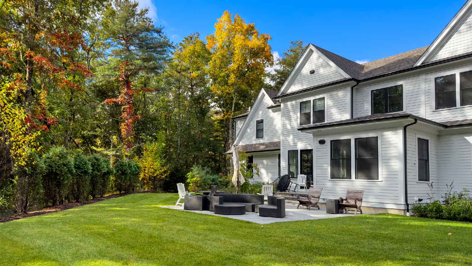 A house with big lawn in the backyard