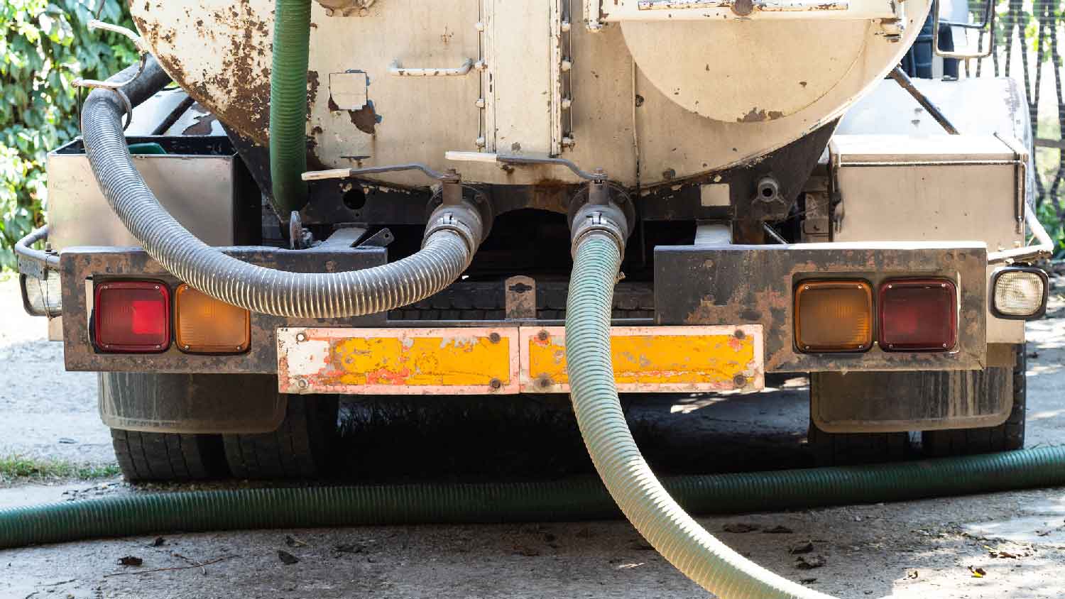 A cesspool truck pumping a cesspool