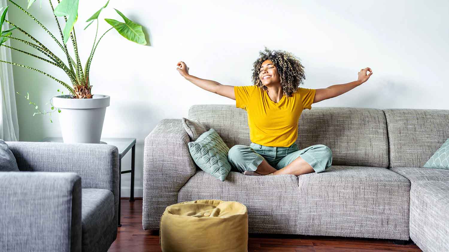 Woman sitting on the couch enjoying her time at home