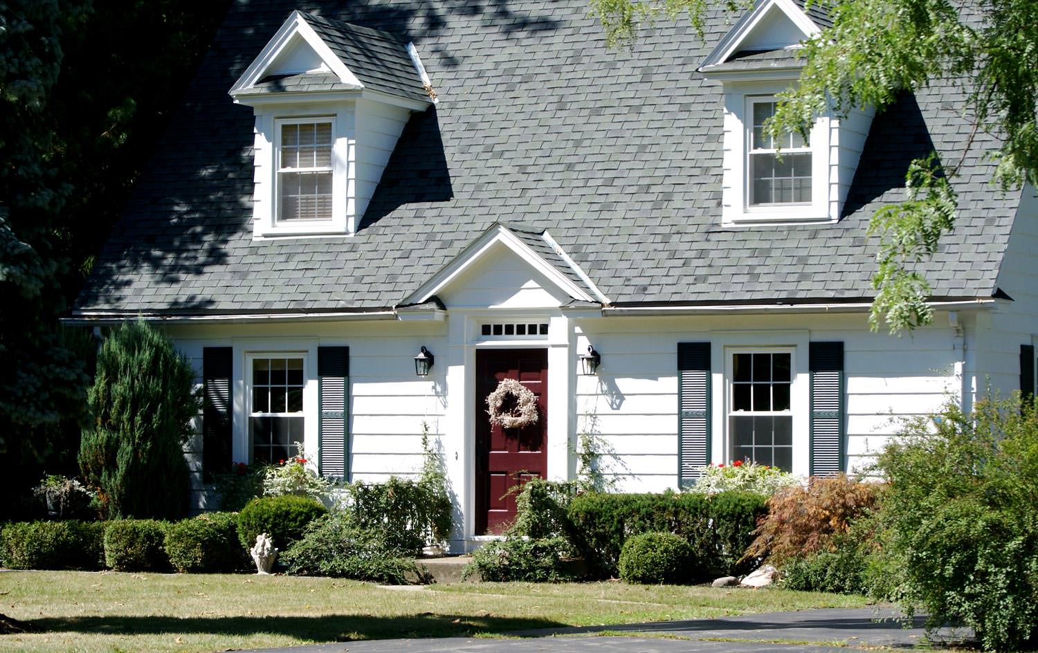 A Cape Cod style house with a steep roof