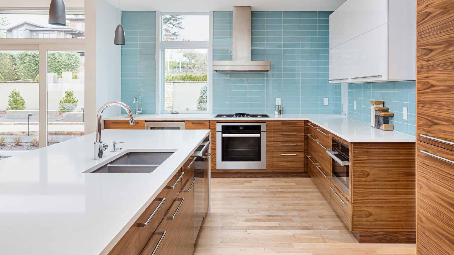 A kitchen with wooden cabinets and flooring