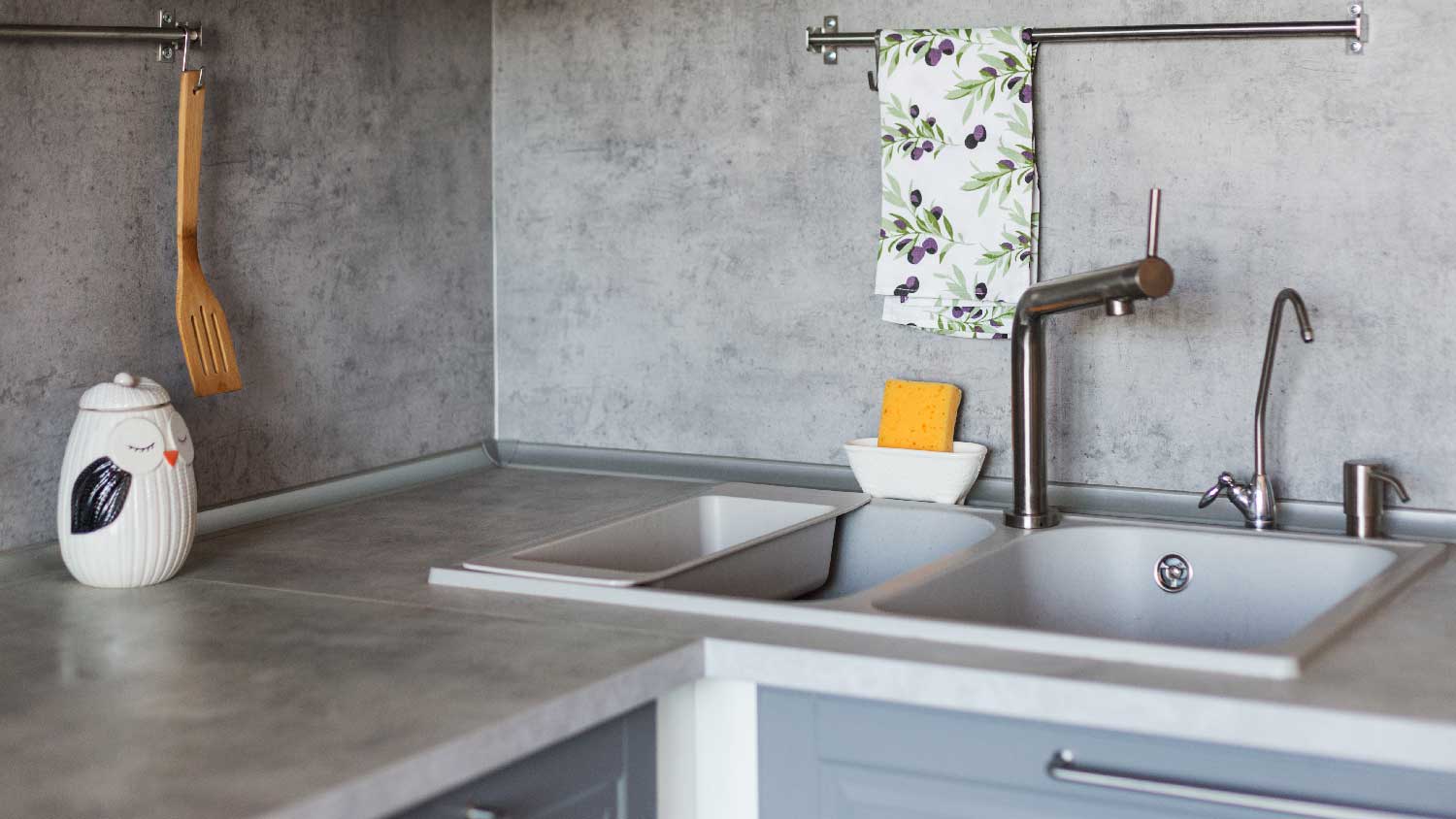 A kitchen with concrete countertop