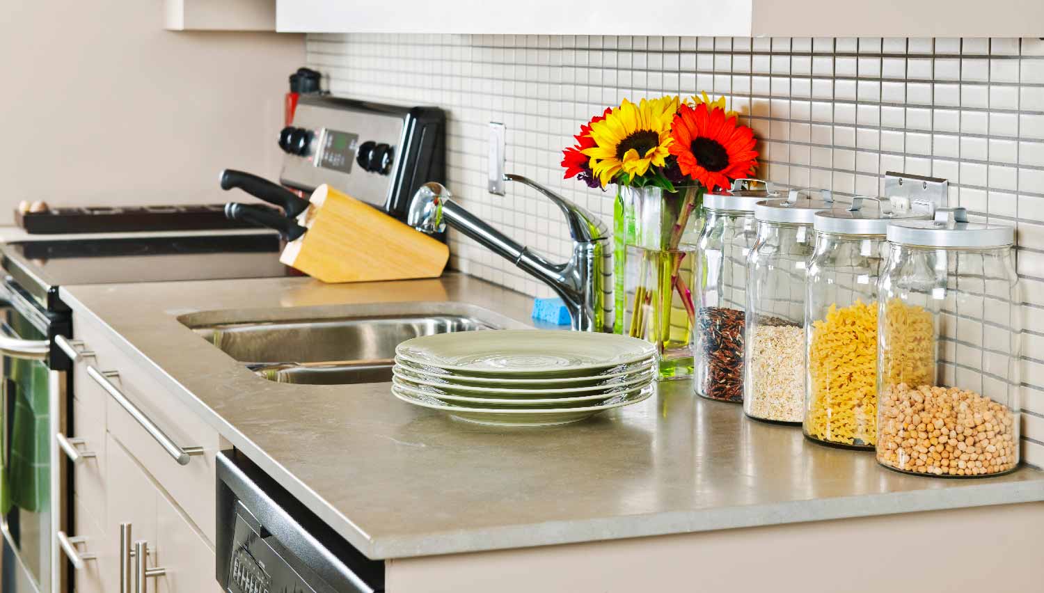 A soapstone countertop in kitchen with jars on it