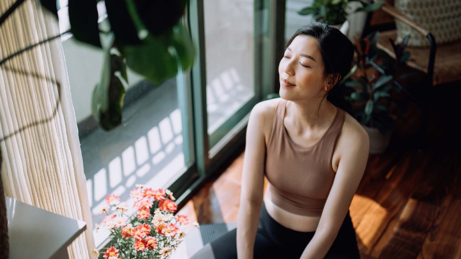 A woman relaxing after a home workout