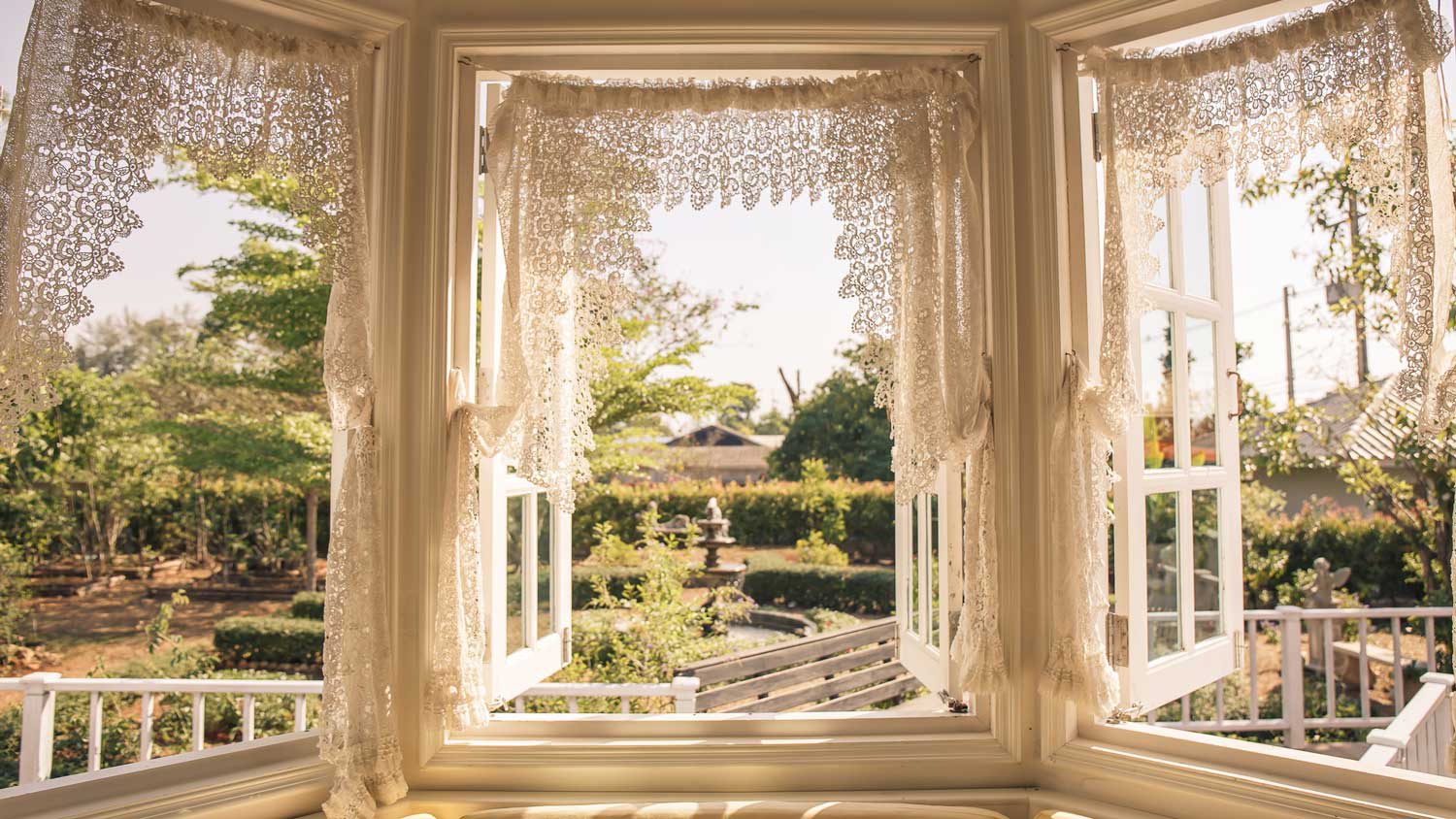 House with vintage windows with a garden view