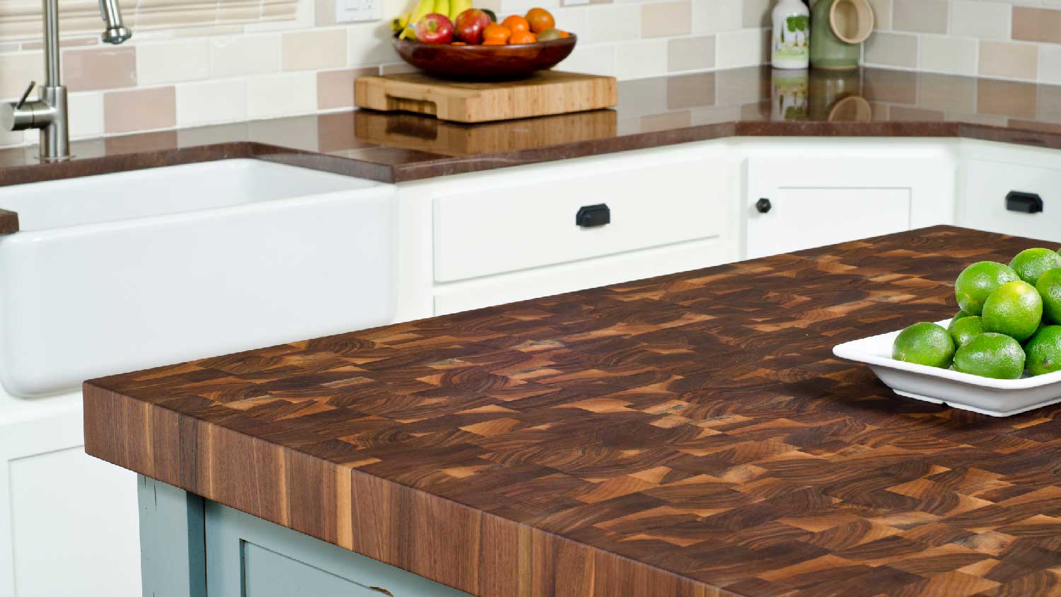 A wooden countertop on a kitchen island