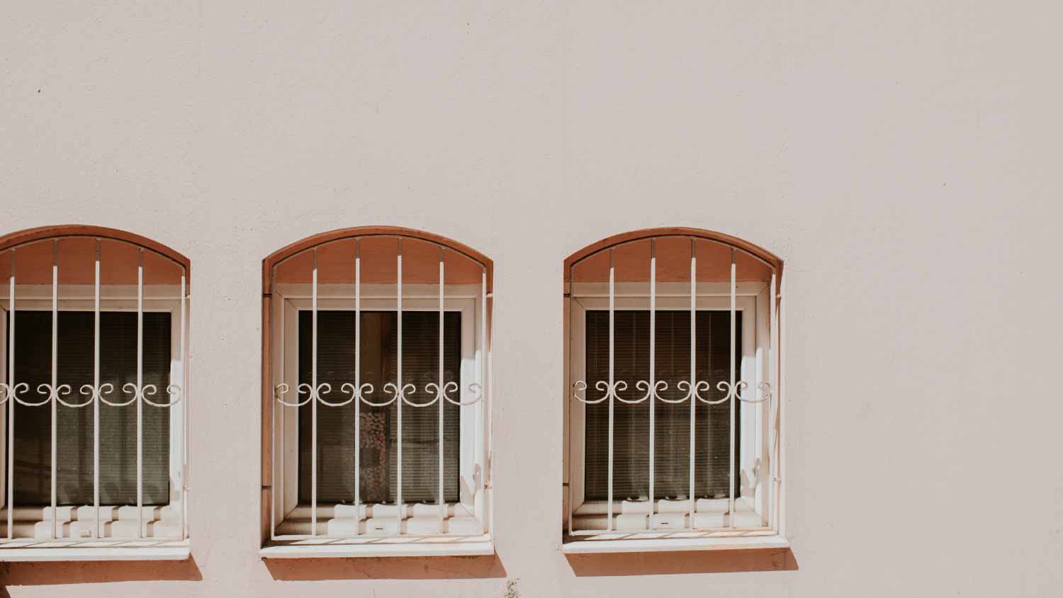 Small windows set in a pink exterior