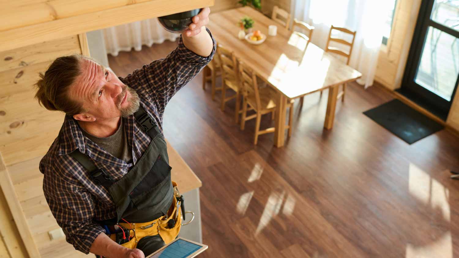 Man adjusting camera