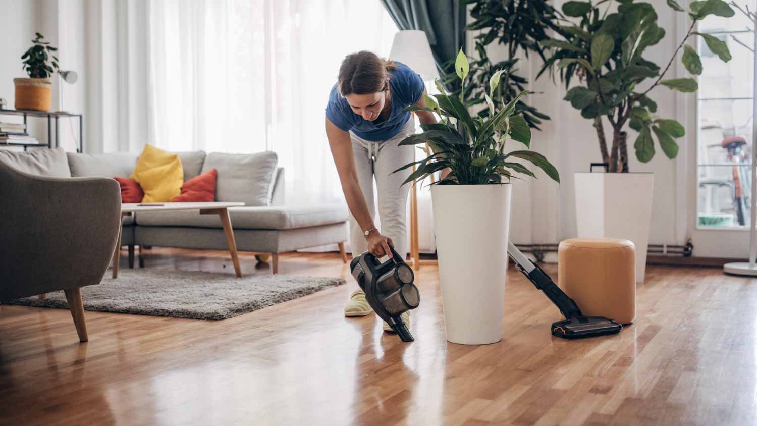 Woman cleaning wooden floor