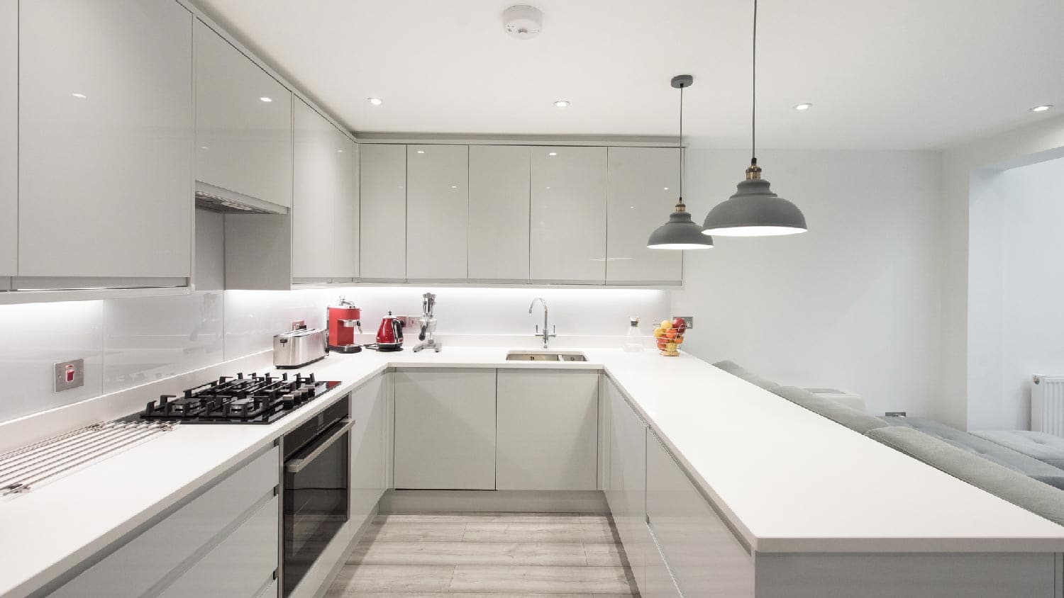 A large kitchen with quartz countertop and appliances on it