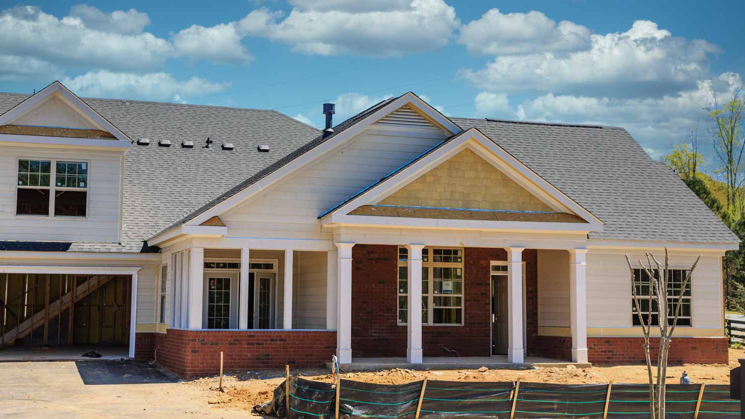 new home under construction with silt fence