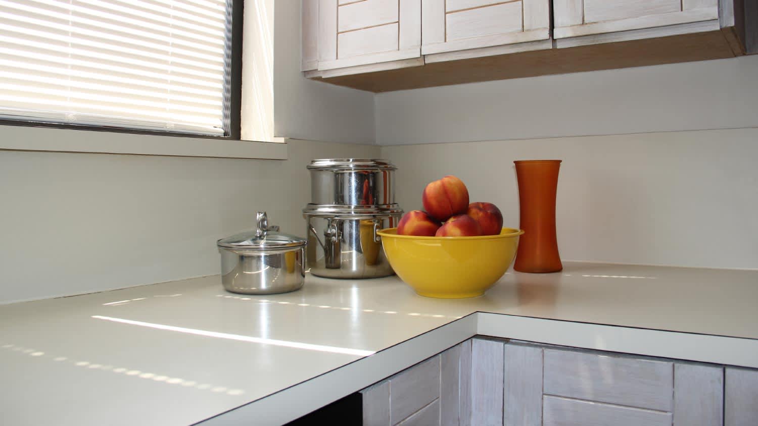 Kitchen counter with cookware and bowl