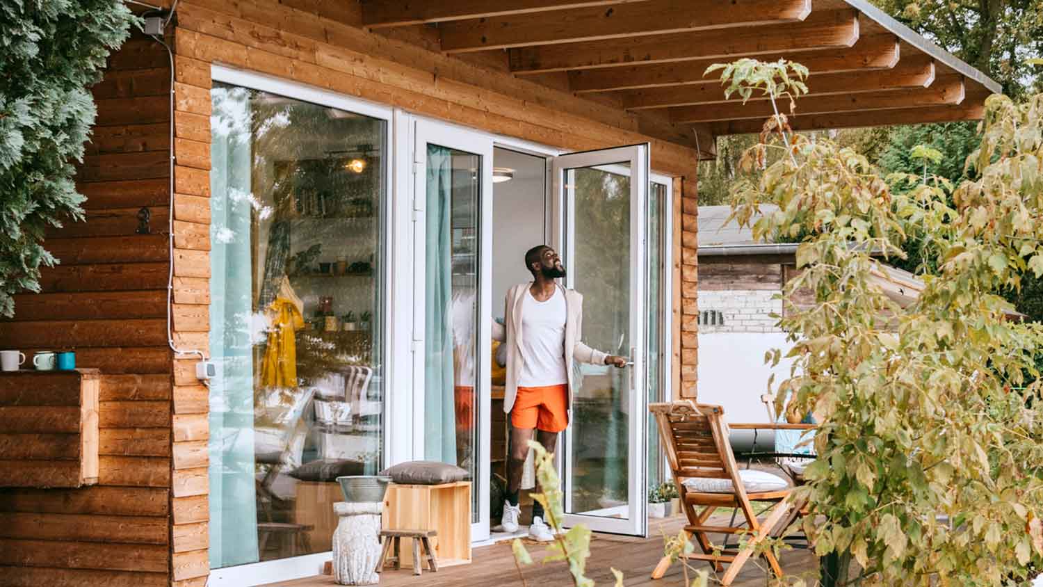 Man opening glass patio door