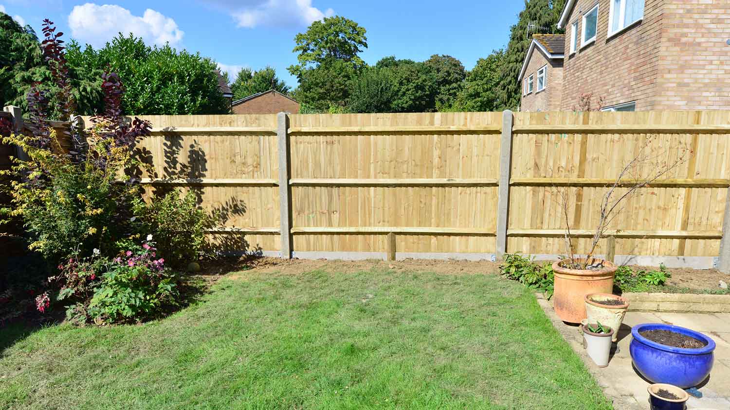 Privacy wooden fence installed in the yard