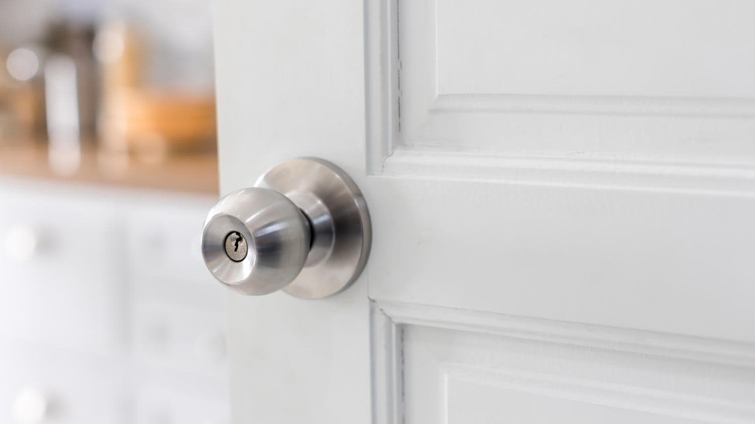 A storeroom door knobA hand holding a door knob